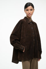 Dark brown suede shirt with pointed collar and dark buttons, long sleeves, flap chest pocket.