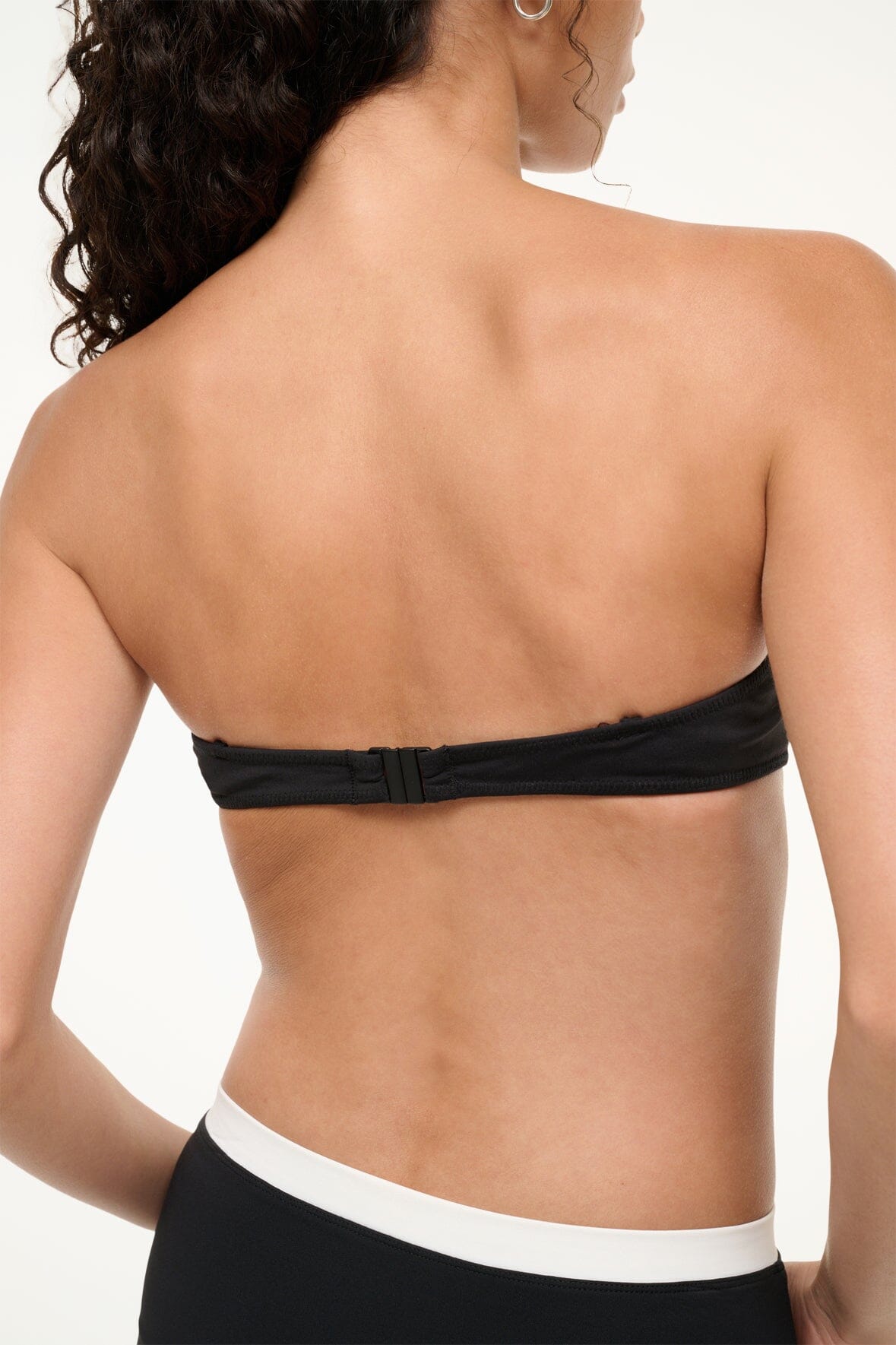 Black bikini top back view with thin straps and white underband
