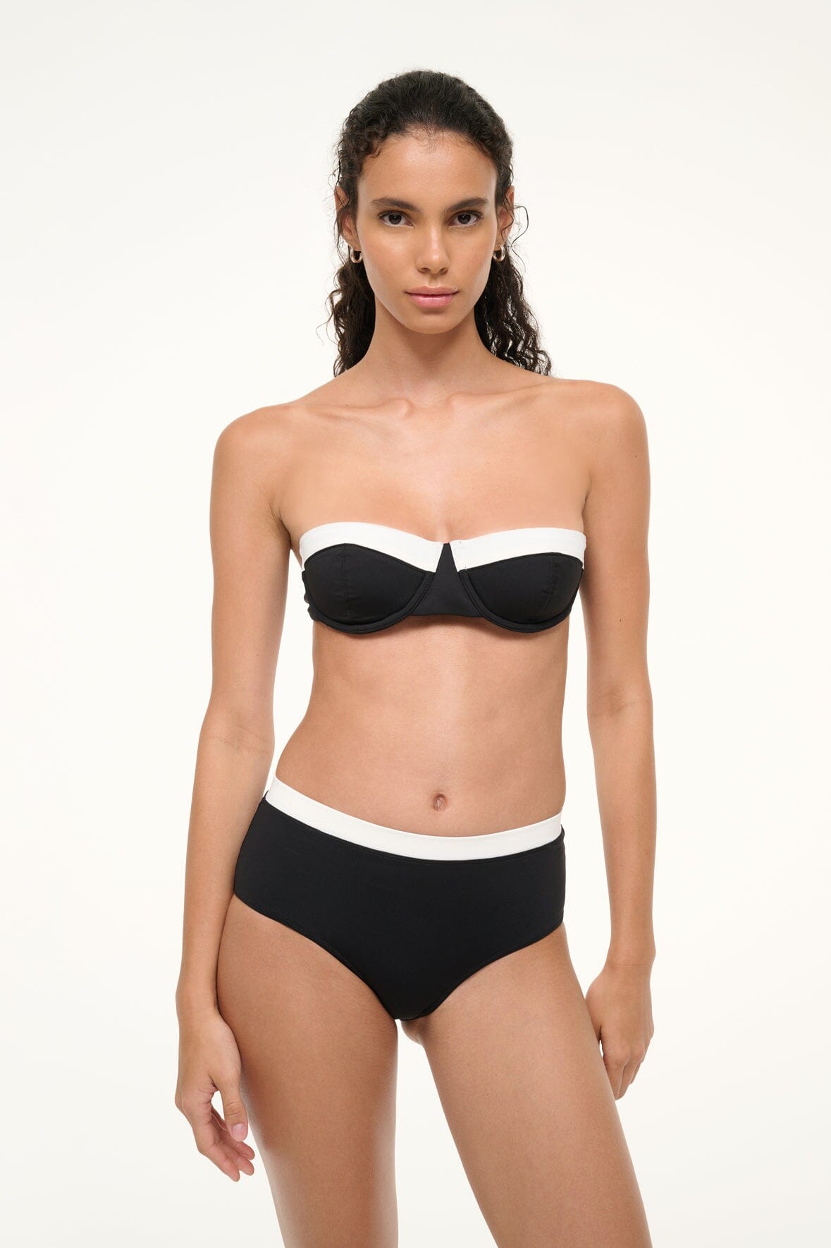 Black balconette bikini top with white band and thin straps, worn front view