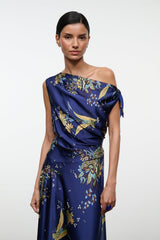 Navy silk off-shoulder dress with draped detail and gold floral tapestry print