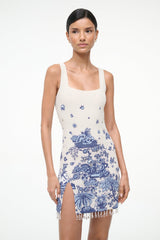 Sleeveless blue toile shift dress with square neckline, thin straps, front slit, tassel fringe
