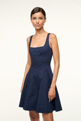 Navy sleeveless scoop-neck skater dress with fitted bodice and pleated skirt