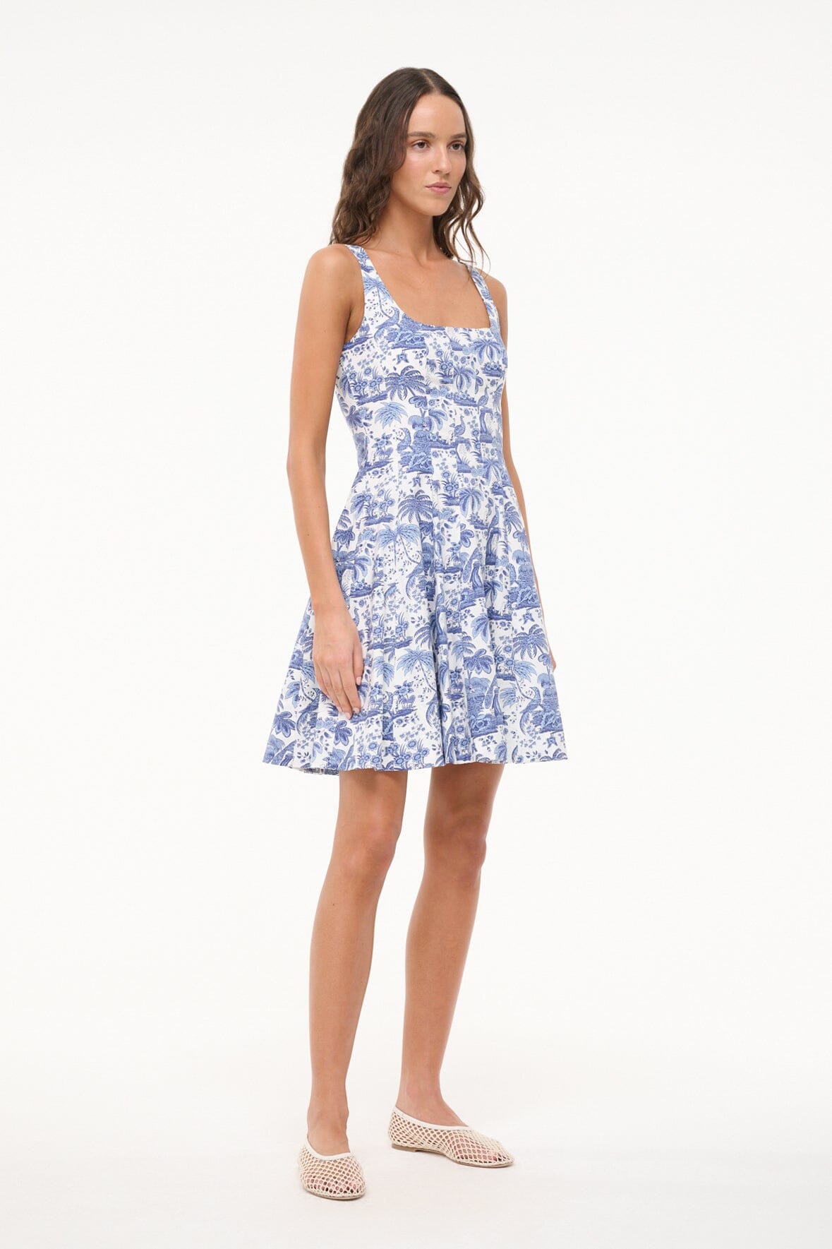 Blue toile mini dress with square neckline and flared skirt, side view