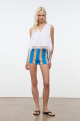 White sleeveless V-neck top with lace-trim hem