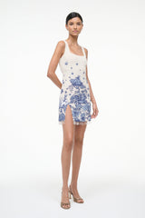Womens sleeveless blue toile shift dress, white base, fitted waist, front slit, tassel hem