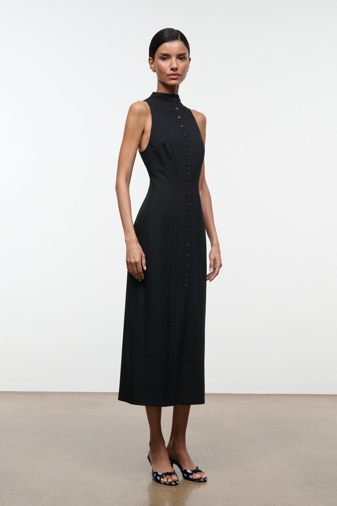 Black sleeveless midi dress with high neck and center button-front placket
