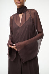 Brown long-sleeve maxi dress with high neck scarf detail and sheer sleeve overlay