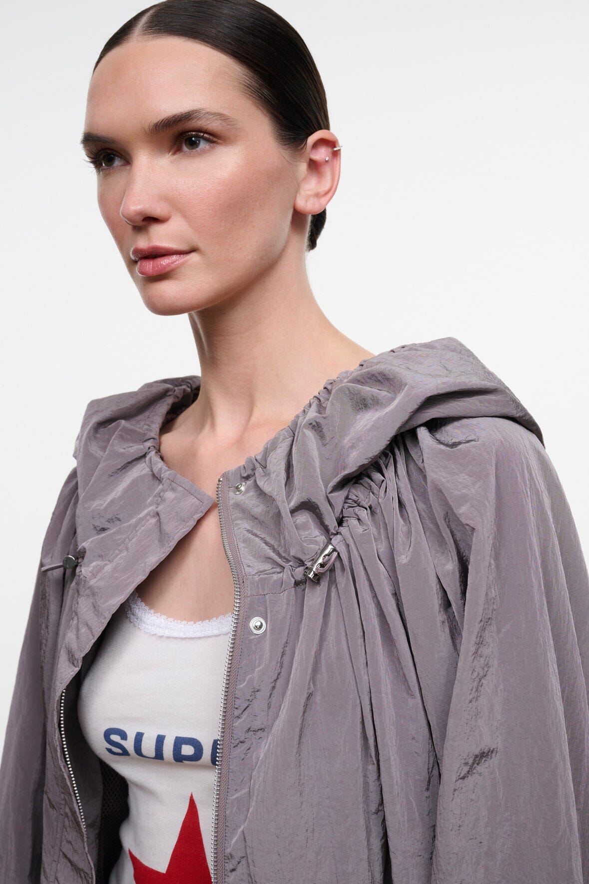 Zinc gray hooded jacket close-up with snap front and adjustable hood