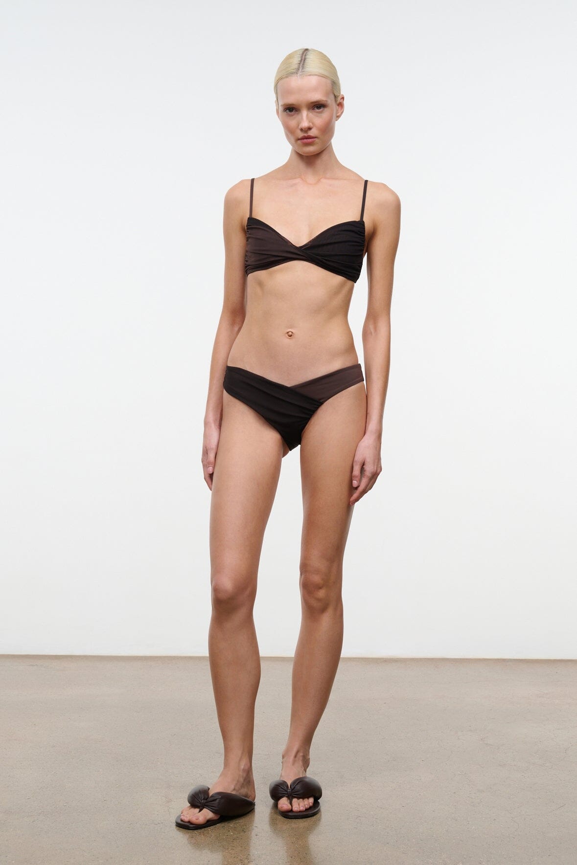 Dark brown bikini bottom with ruched waistband and gathered side seams