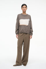 Taupe pullover sweater with white sheep graphic, ribbed hem and cuffs