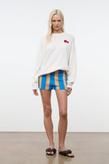 Blue vertical striped shorts with orange and beige stripes, elastic waistband