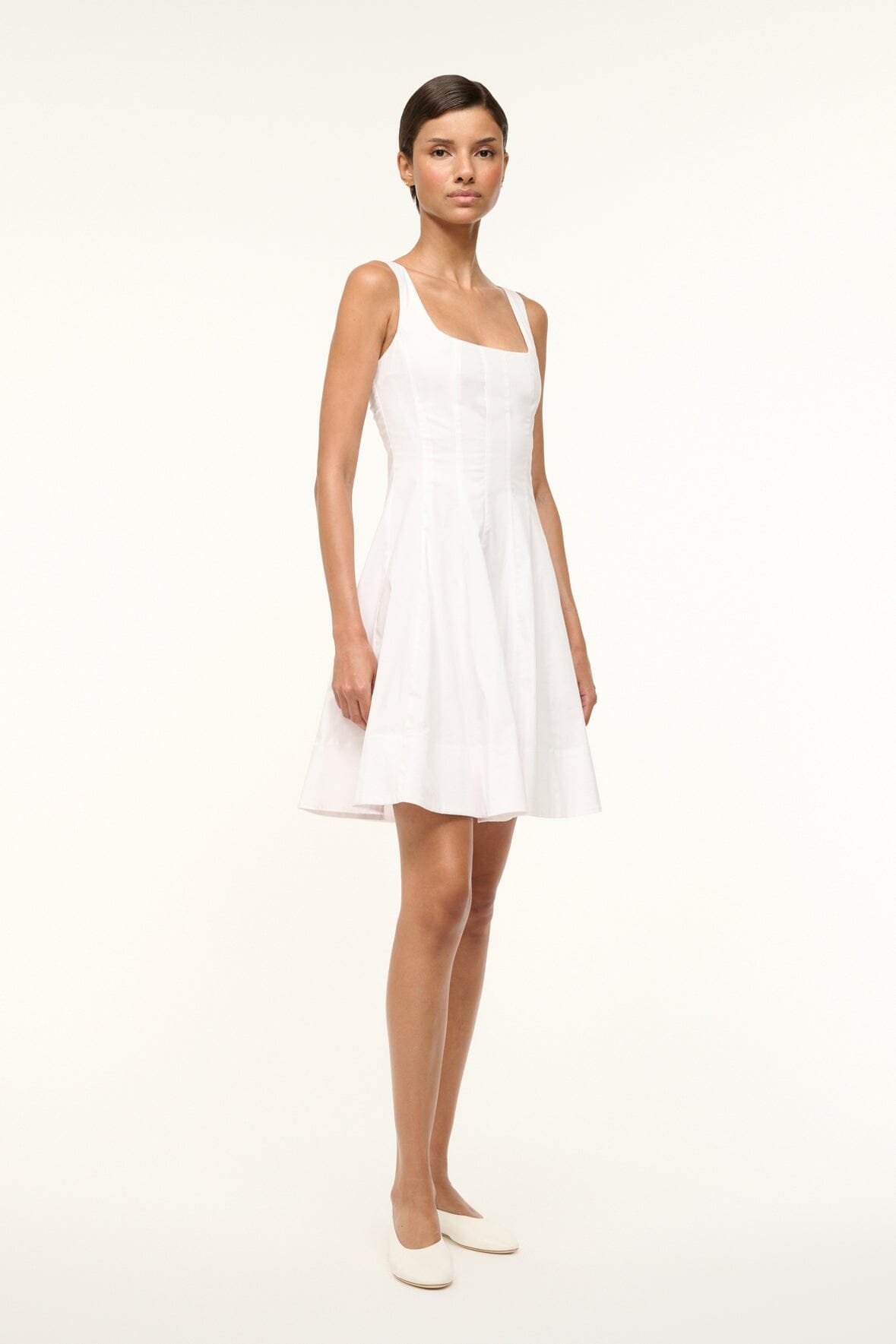 White sleeveless mini dress with square neckline and A-line silhouette