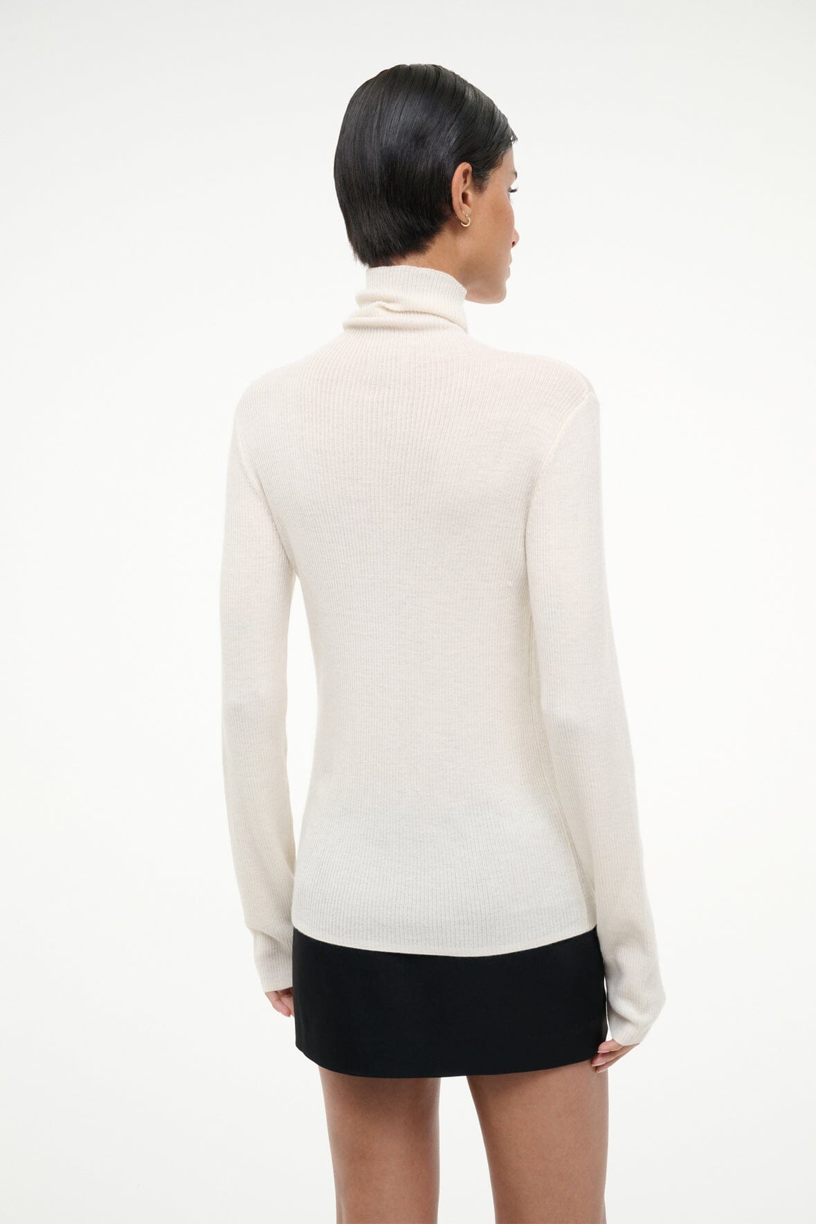 Ivory cashmere turtleneck sweater, long sleeves, back view.