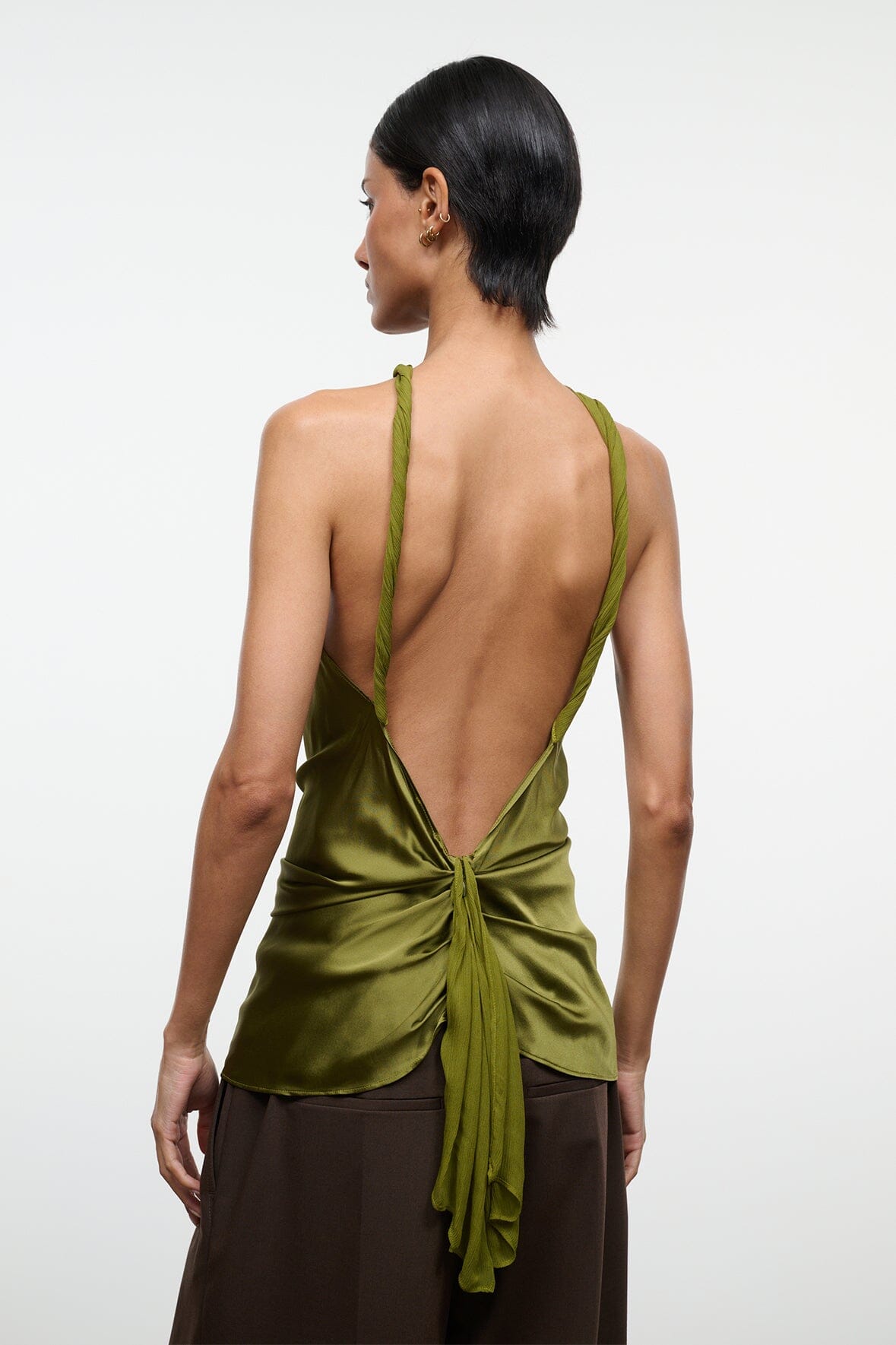 Olive green silk halter top with open back and tied center-knot detail