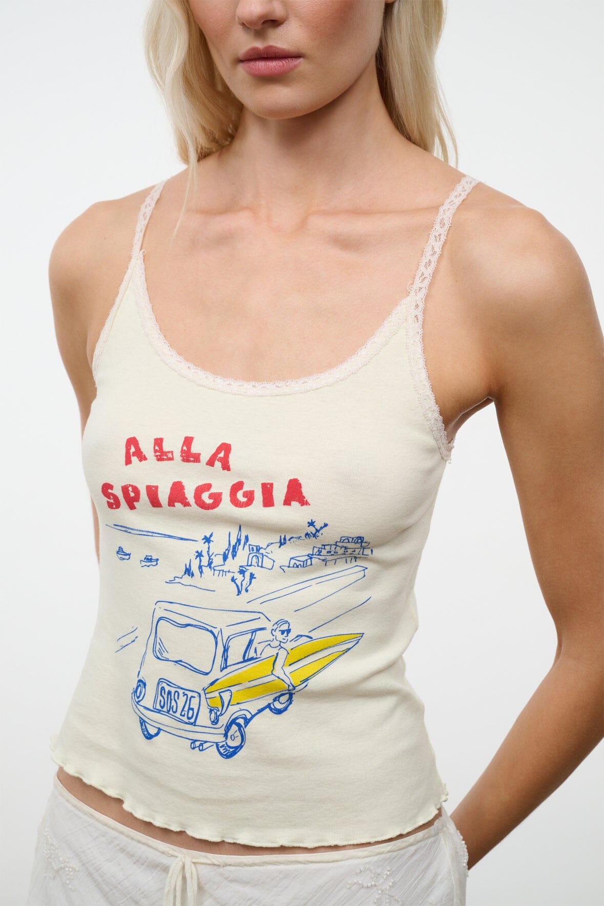 Cream sleeveless graphic camisole top with red-blue seaside print