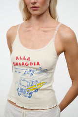 Cream sleeveless graphic camisole top with red-blue seaside print