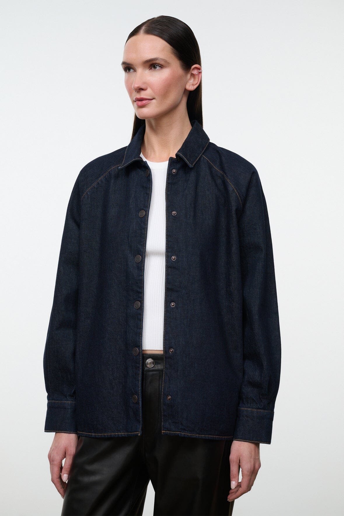 Indigo denim shirt jacket front view with button placket and contrast topstitching