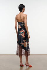 Black silk dress with floral tapestry print, lace-trim hem, spaghetti straps (back)