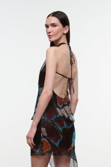 Printed sleeveless halter top with open back tie straps and draped front