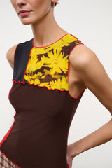 Sleeveless Primo top in dark brown with yellow floral front panel and red trim at edges
