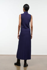Midnight pleated midi skirt, back view, elastic waistband