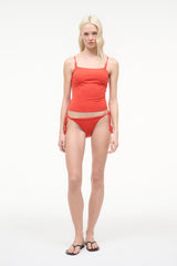 Red tankini top with adjustable spaghetti straps and ruched front