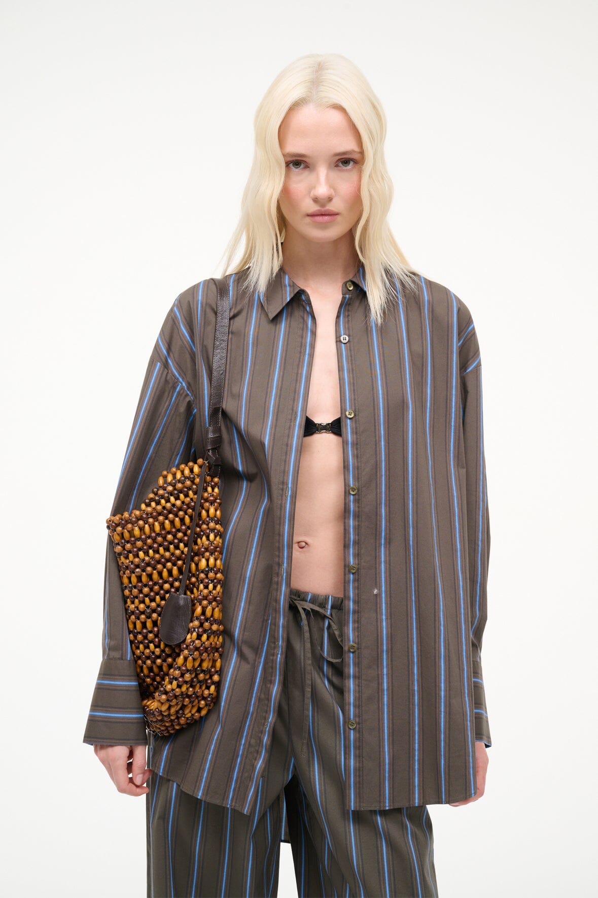 Drift shoulder bag with multi wood beads, black straps, and a rounded hobo shape