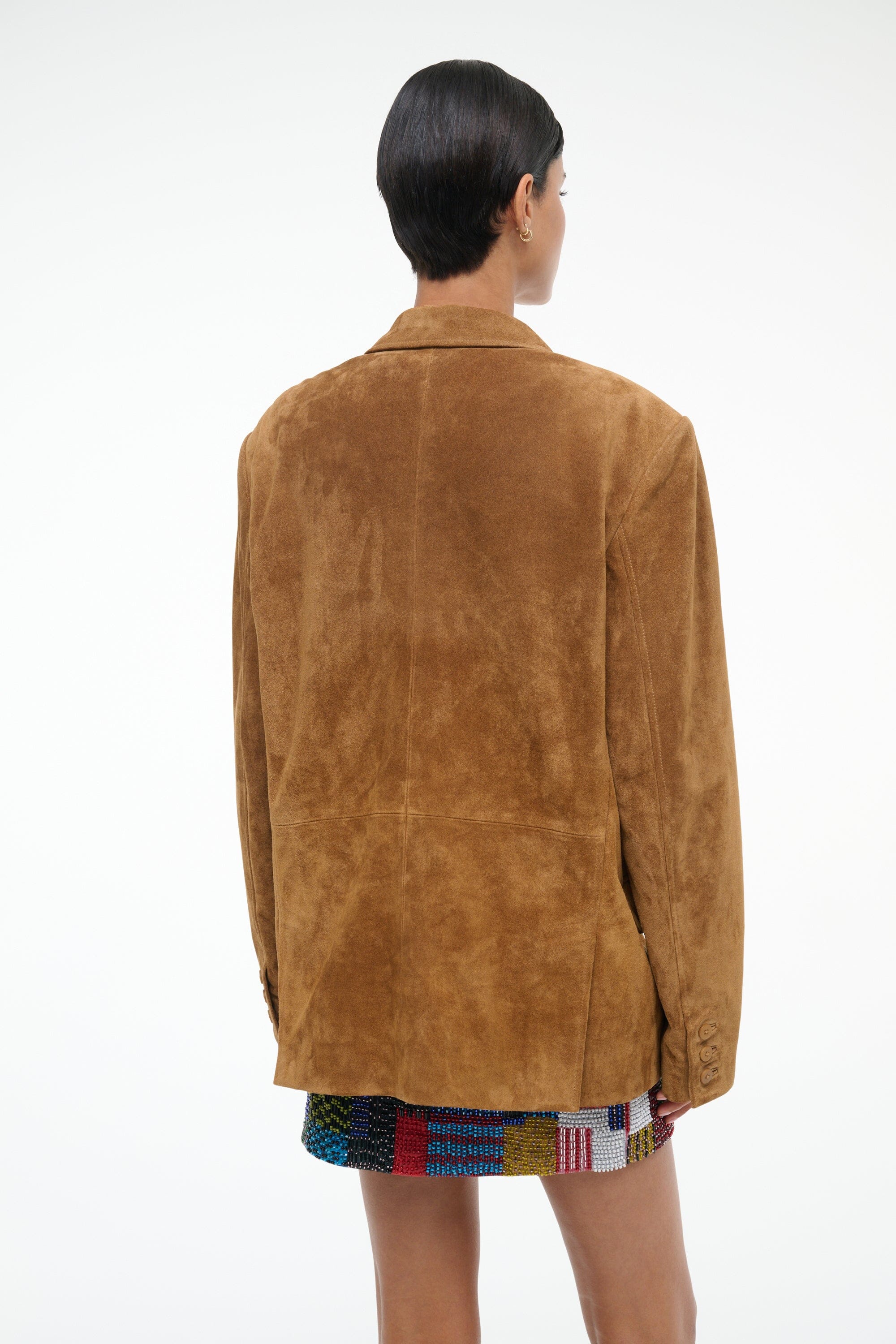 Tan suede jacket, back view with notched collar and vented hem