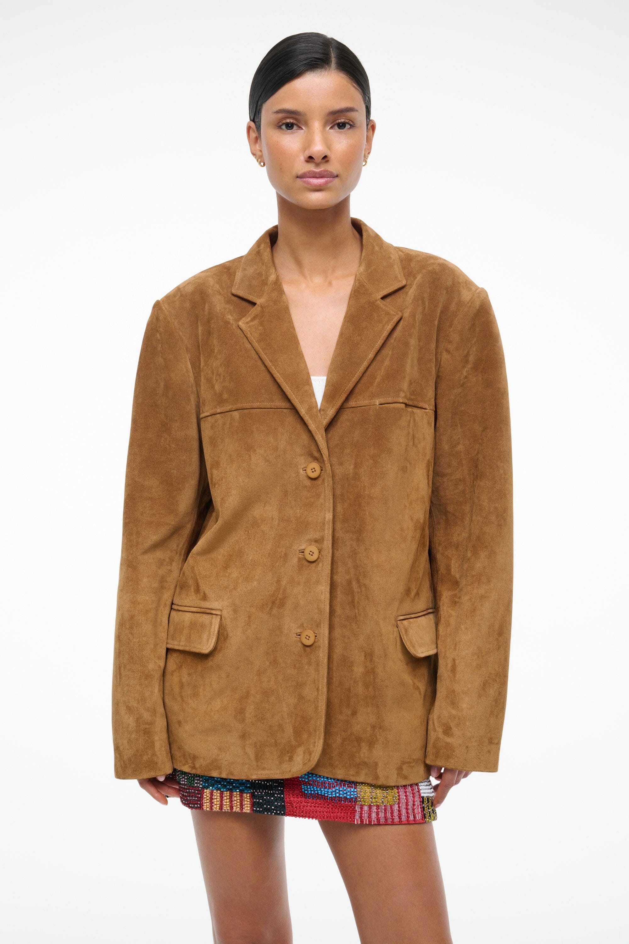 Tan suede blazer jacket with notched lapels and four-button front