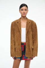 Tan suede jacket with notched lapels and buttoned patch pockets