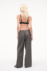 Dark vertical striped wide-leg pants with drawstring waist, relaxed fit.