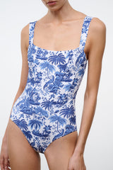 One-piece swimsuit with thin straps and blue toile bird, plant, and scroll print