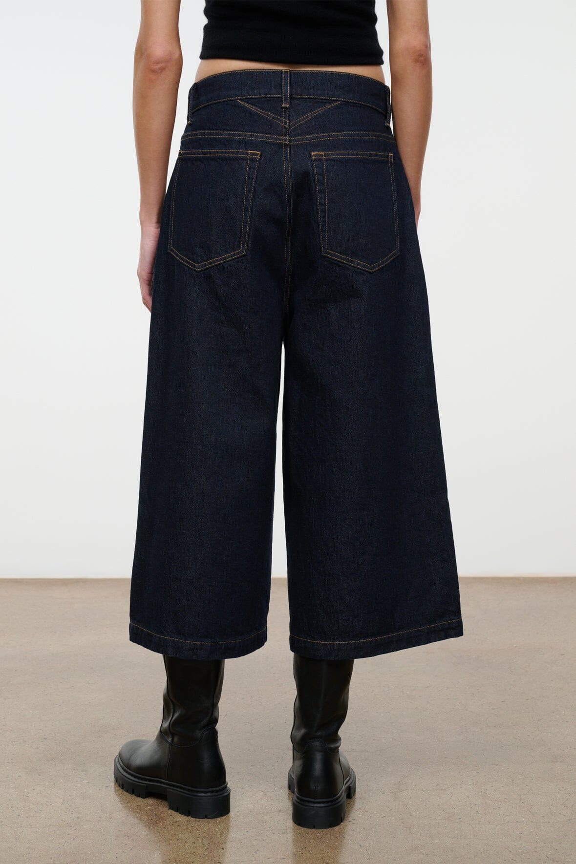 Hunter indigo denim culotte jeans, wide leg, back view with patch pockets and yoke