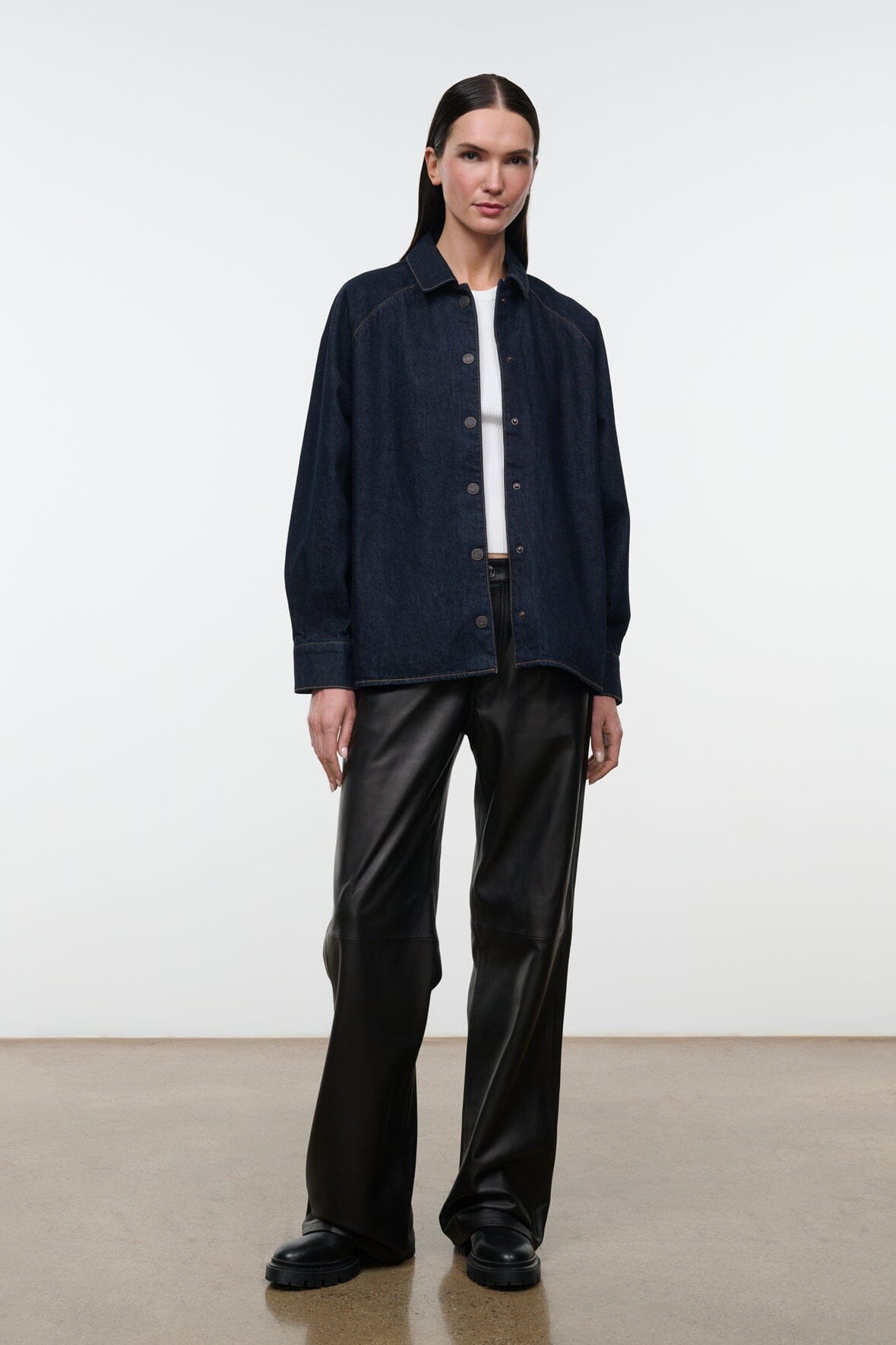Indigo denim shirt jacket with button front, pointed collar, and long sleeves