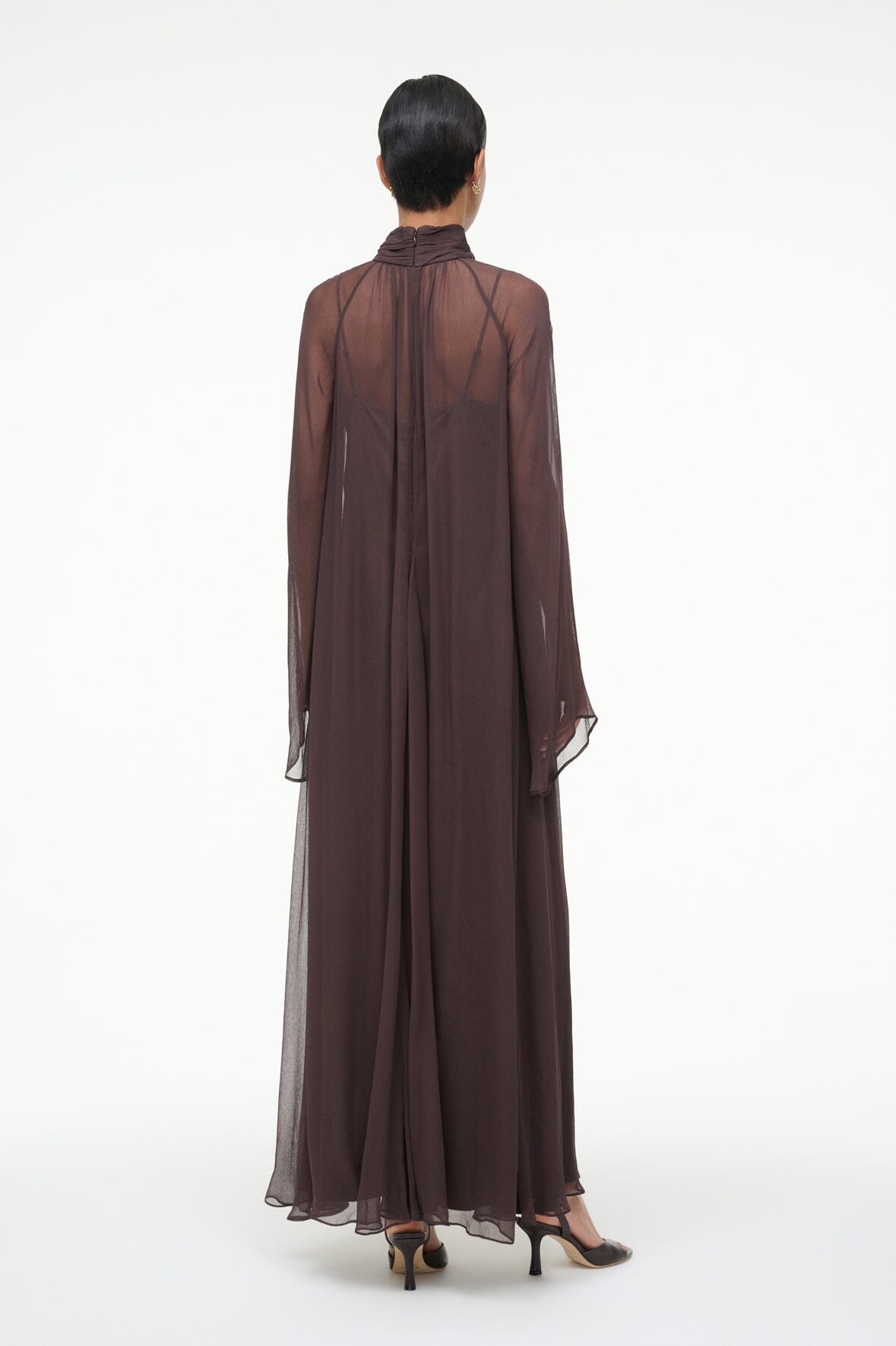 Brown maxi dress from back view with long sheer sleeves and flowing silhouette