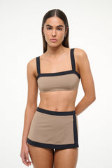 Women’s taupe swim skirt with contrasting black waistband and hem band