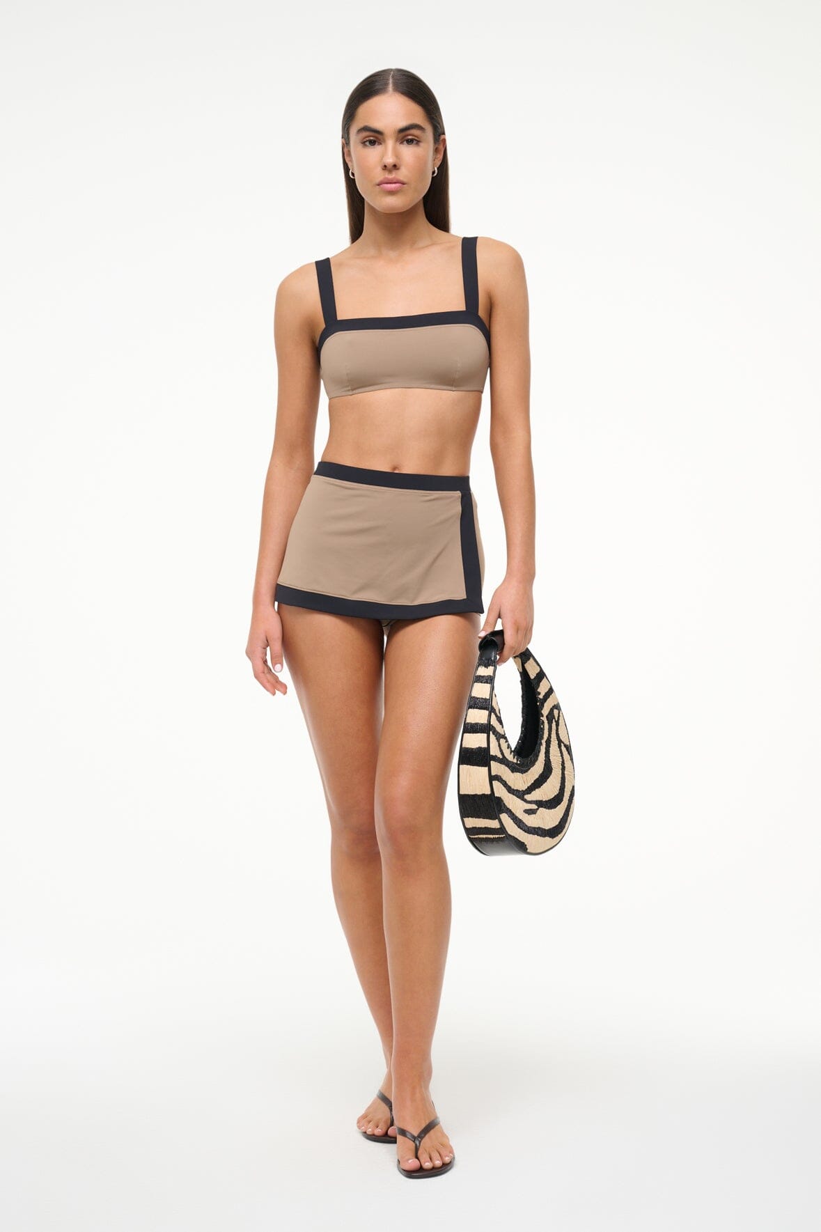 Women’s taupe swim skirt with black trim hem and layered swim style