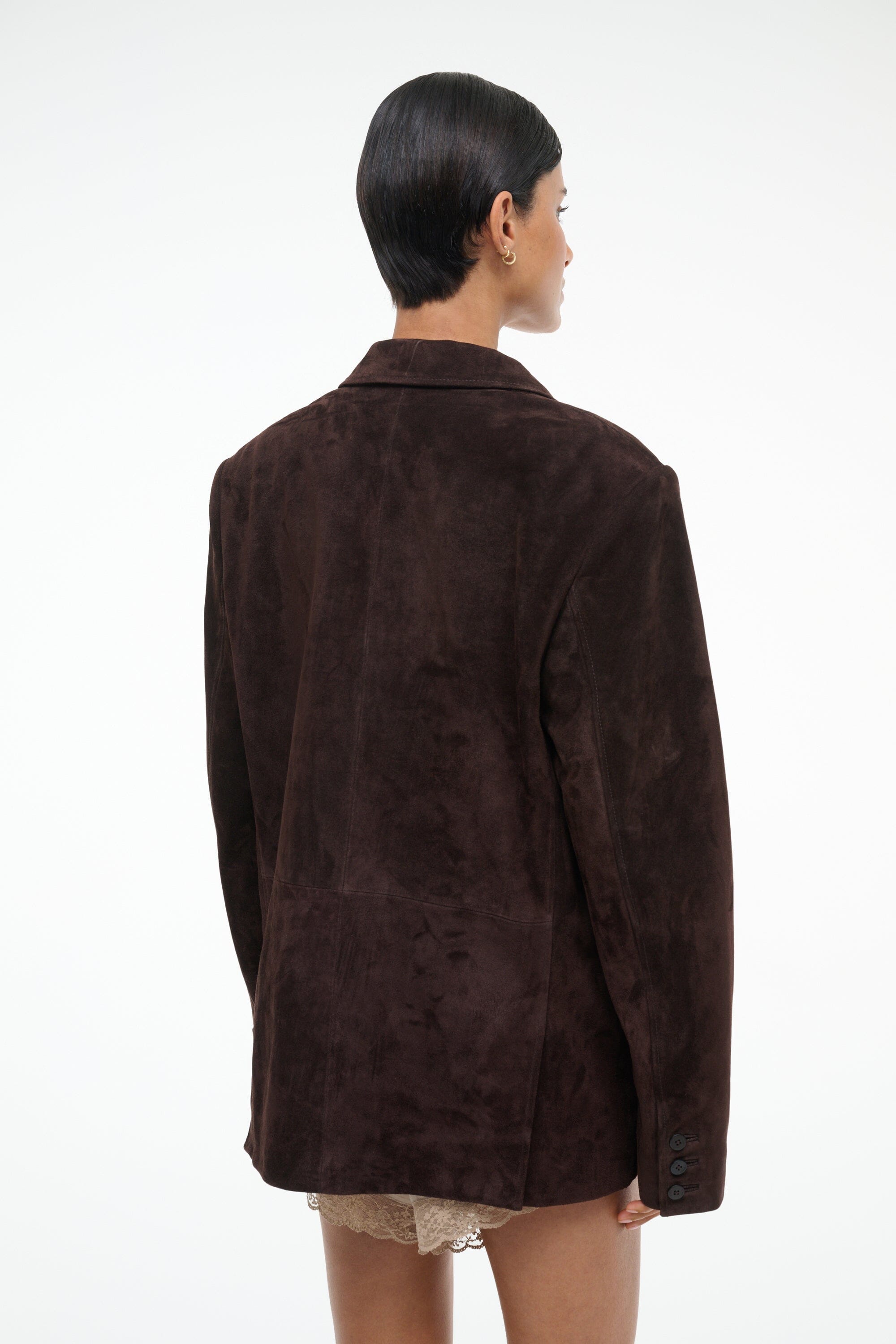 Women's espresso-brown suede jacket, back view with long sleeves and vent detail
