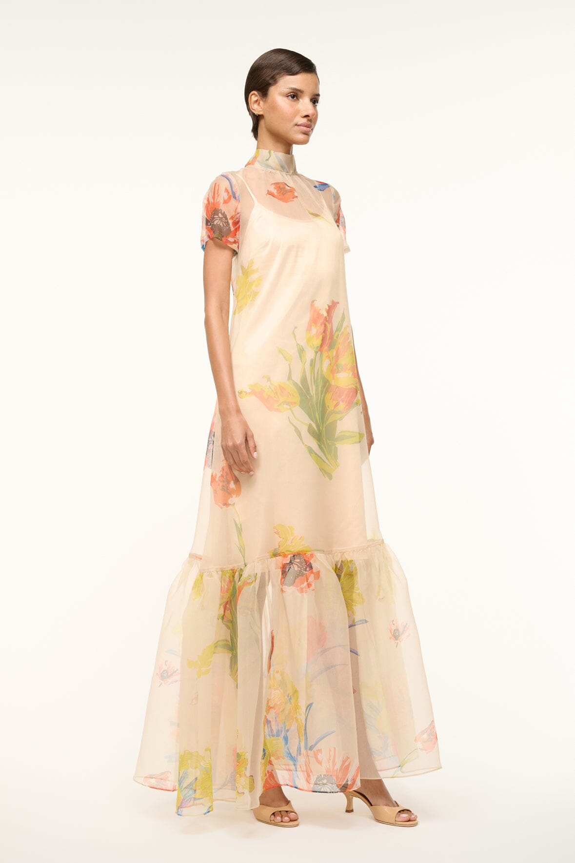 Peach floral maxi dress with short sheer sleeves, round neck, and tiered hem