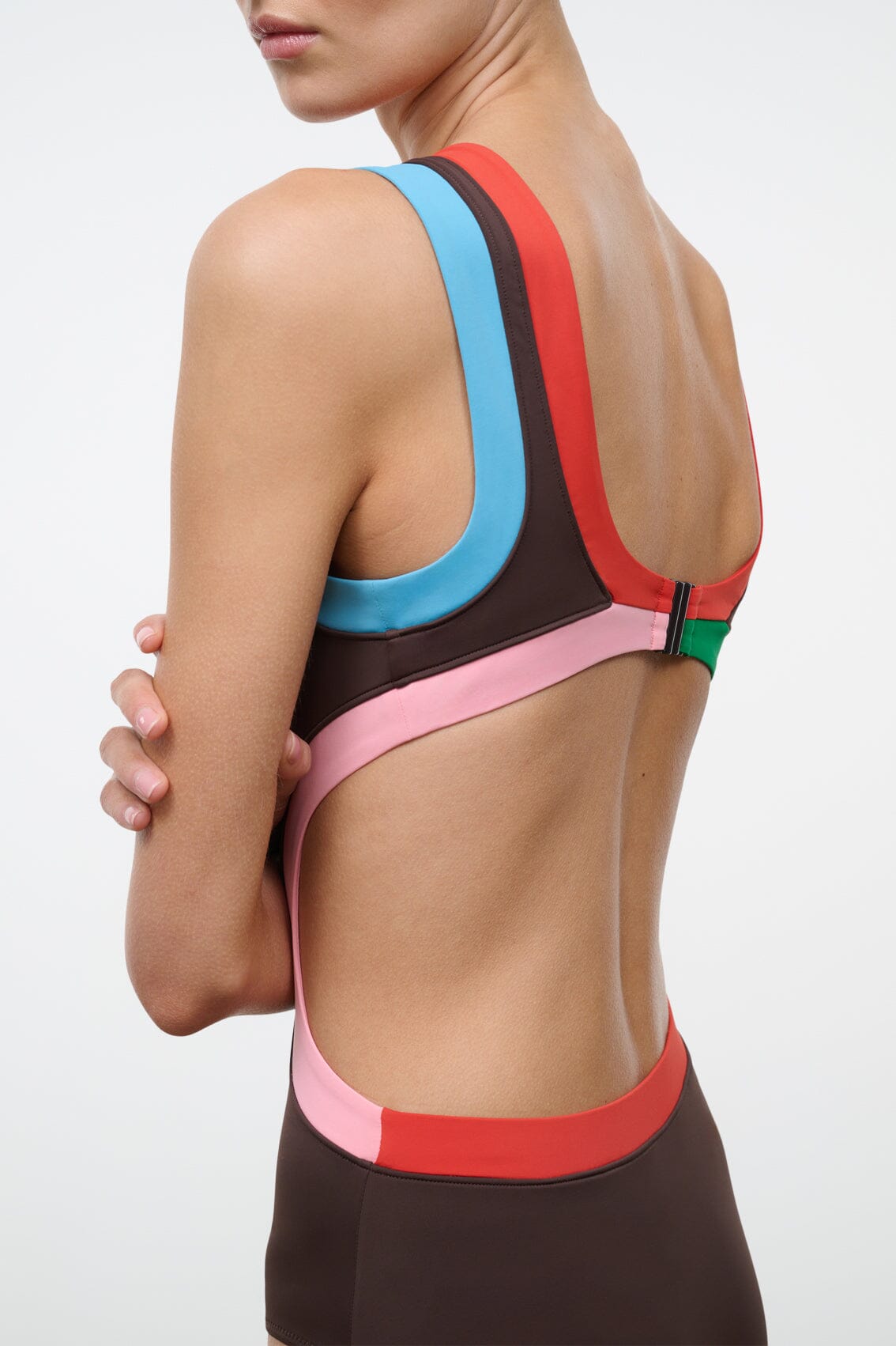 Dark brown one-piece swimsuit back with blue, red, green straps and pink band