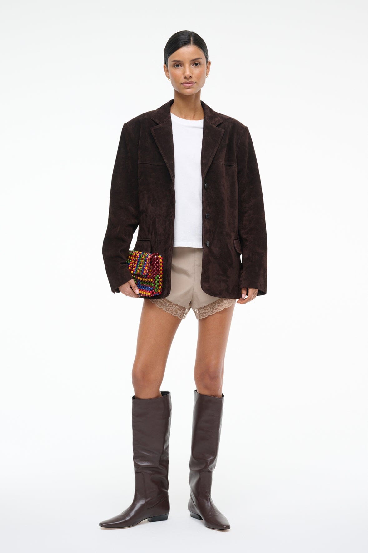 Women's espresso-brown suede jacket with notch lapels and flap pockets, side view