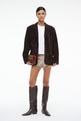 Women's espresso-brown suede jacket with notch lapels and flap pockets, side view