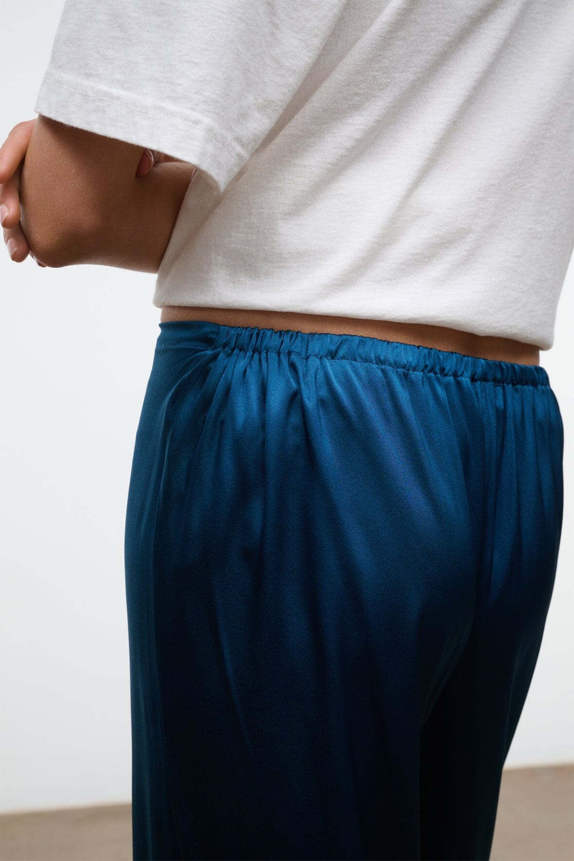 Close-up of blue silk elastic waist with gathered top edge