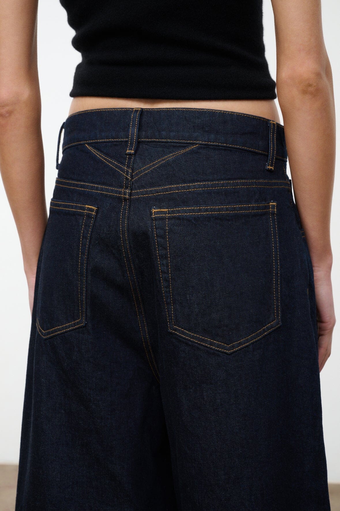 Hunter indigo denim culotte jeans, close-up of waistband with belt loops and stitched yoke