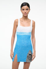 Blue sequined mini dress with white straps and shark graphic side slit hem
