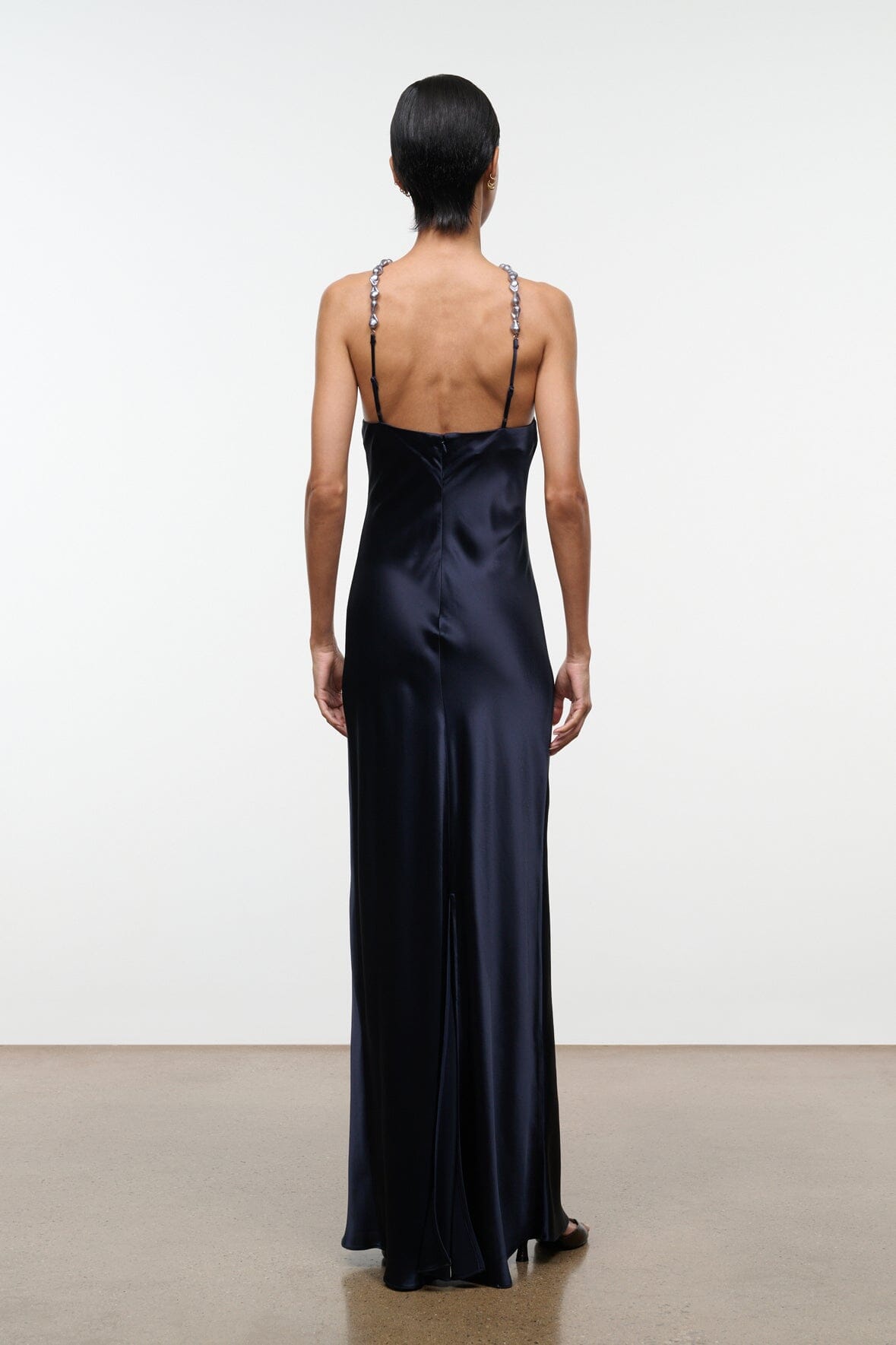 Navy satin maxi dress with open back and beaded halter straps