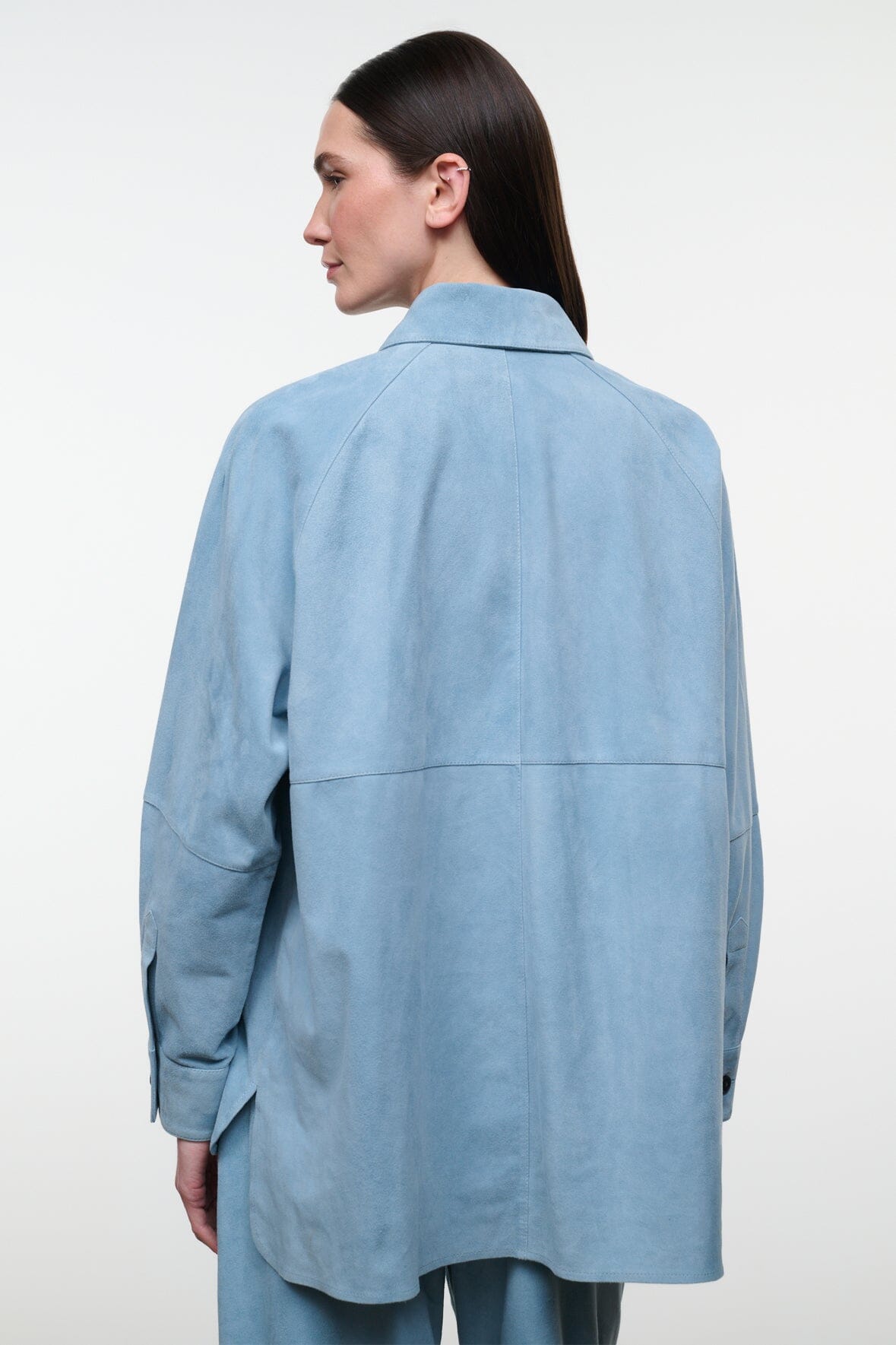 Sky-blue suede shirt, back view with yoke seam and long sleeves; buttoned collar
