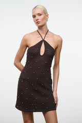 Dark brown halter mini dress with crisscross straps and rhinestone stud pattern