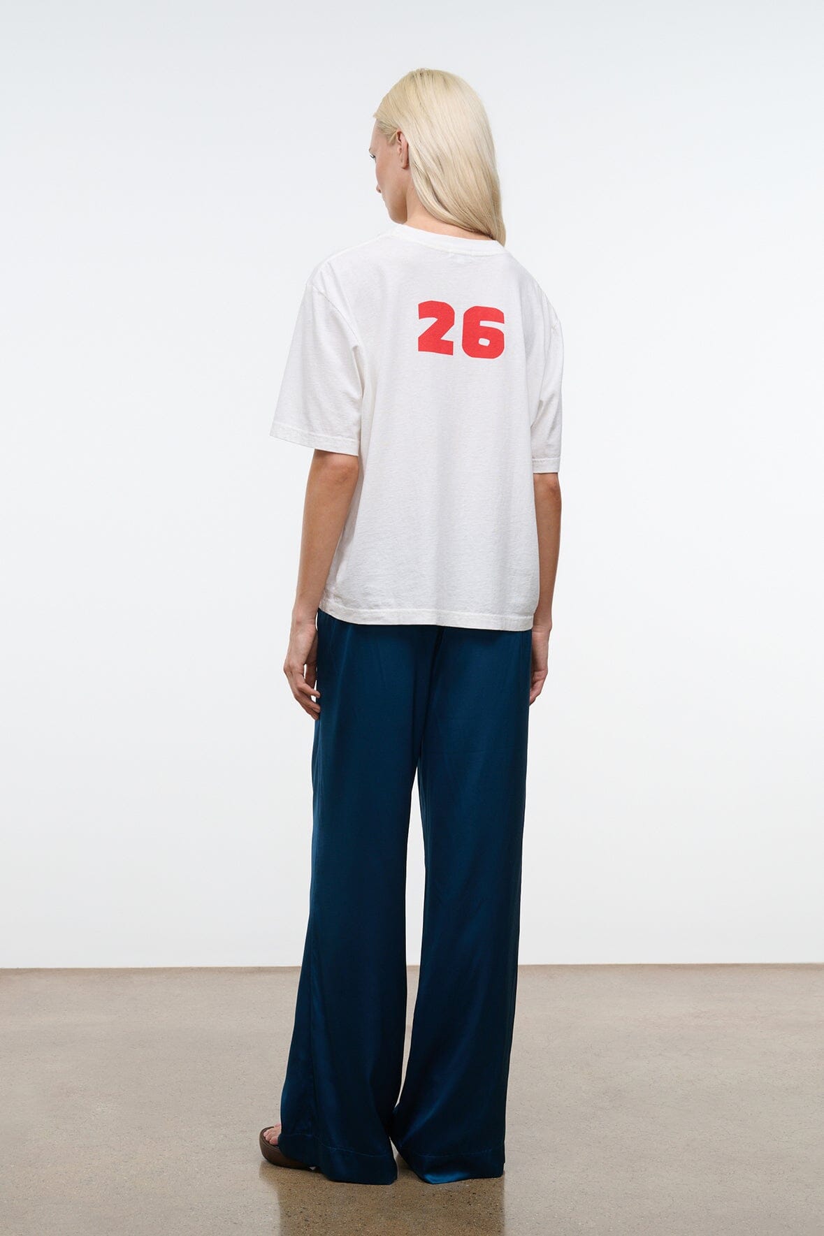 Back view of blue silk wide-leg pant with elastic waist