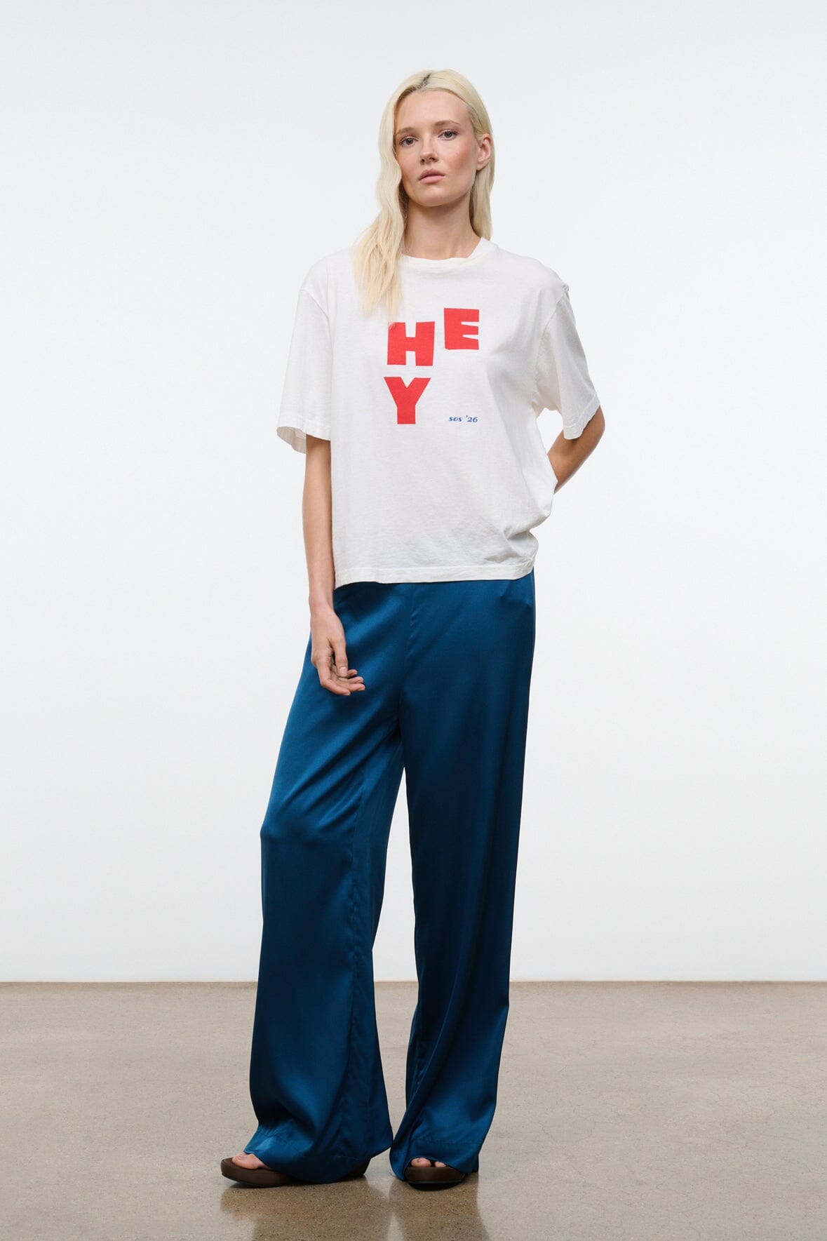Front view of blue silk wide-leg pant with elastic waistband and long drape